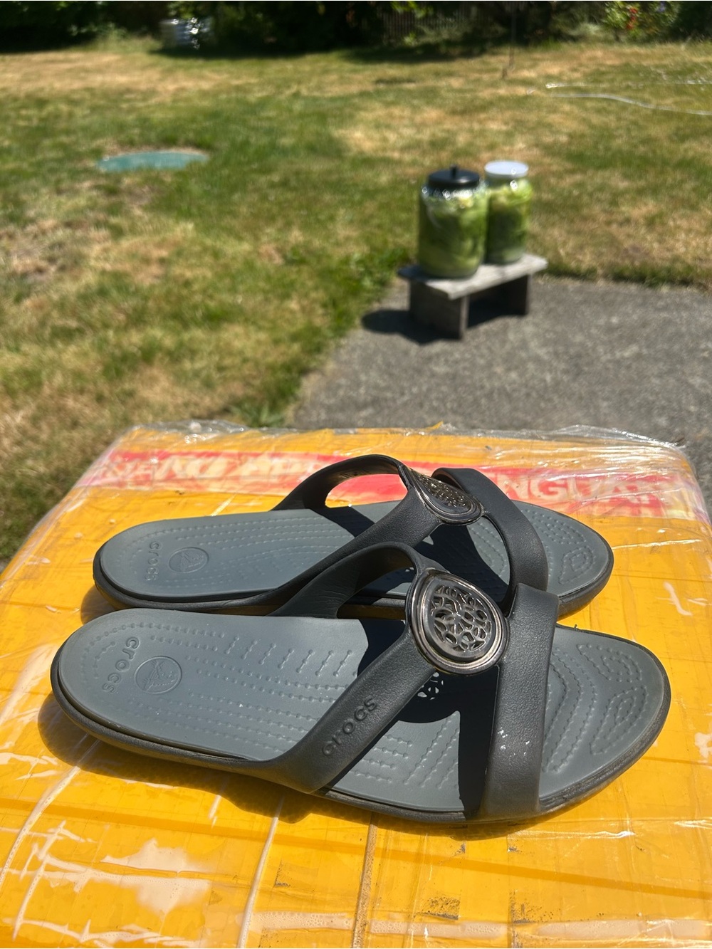 CROCS Gray Cross-Strap Women’s Slide Sandals with Decorative Medallion Size 10